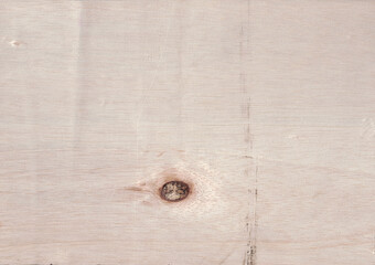 Light plywood wood texture background with natural knot imperfection detail