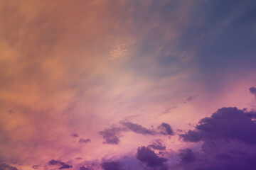 Beautiful sunset sky above clouds with dramatic light. Cabin view from airplane