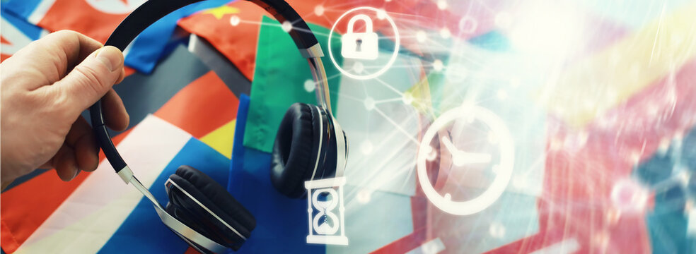 Background concept polyglot. Headphones and flag. The study of foreign subjects. Audiobooks in a foreign language.