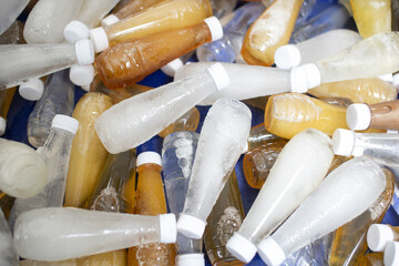 Drinking water and fruit juice in plastic bottles.