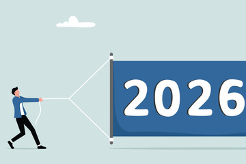 The change of year from 2025 to 2026, the concept of the world economy, a businessman who tries to unfurl the new year banner 2026.