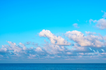 Nature of the ocean and blue sky Summer with sunshine, sandy beaches, clear blue waters sparkling against the blue sky. on an island with good ecology and environment Background for summer vacation