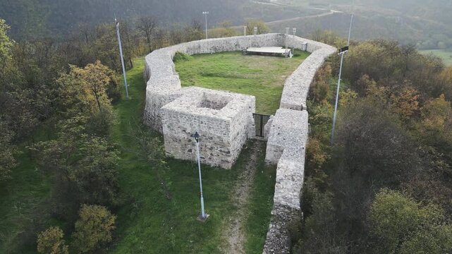 The Hisar fort, a medieval fortification and important historic landmark located on the top of Hisar hill near Prokuplje, Serbia. Descending drone video.