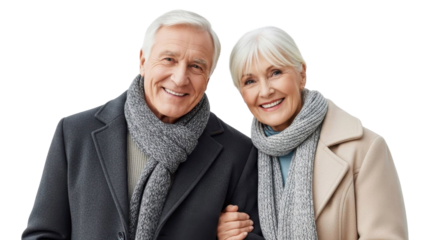 Smiling senior couple in warm winter coats and scarves on a transparent background PNG file