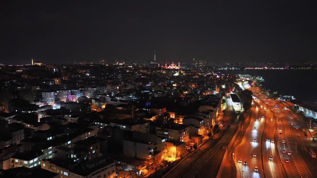 The Blue Mosque synagogue temple Istanbul city skyline nighttime Turkey T&uuml;rkiye aerial drone traffic cars panoramic landscape city scape Bosphorus Strait harbor view buildings Golden Horn upwards