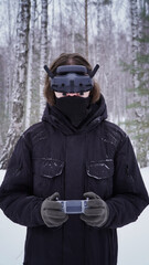 FPV drone operator, close-up, face with glasses