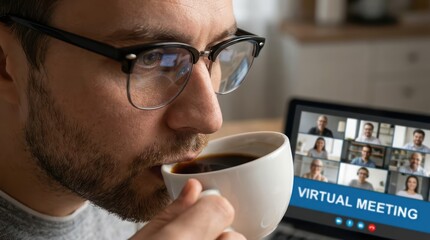 close-up of man drinking coffee during virtual meeting in home office setting with multiple participants on screen