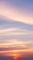 Obraz premium Serene Pastel Sunset Sky with Wispy Clouds