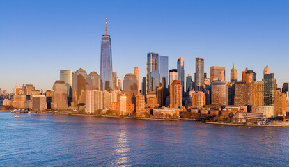 New York City skyline with skyscrapers at dusk. NYC night skyline with Manhattan. New York panoramic cityscape. New York City aerial view of Manhattan. New York skyline with Tower at dusk.