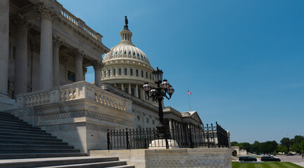 Obraz premium Capitol Building. Historic symbol of American democracy. United States Congress in Washington, DC. The Capitol dome over Capitol Hill. Federal government in the nation's capital.