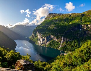 Deep fjord with cascading waterfalls, nestled between lush, green mountains