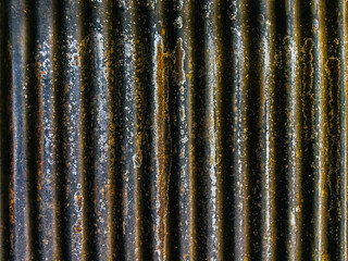 Artistic of old and rusty zinc sheet wall. Vintage style metal sheet roof texture. Pattern of old metal sheet. Rusting metal or siding. Corrosion of galvanized. Background and texture in retro concept
