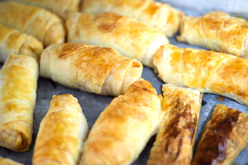Freshly baked pastries. Homemade long potato pastries. Calories, carbohydrates. Top view, above, up. 
