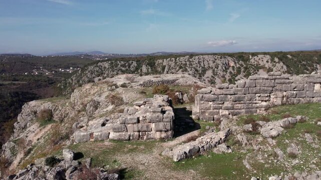 Aerial view of Daorson ruins near Stolac, showcasing ancient Illyrian stone walls and dramatic rocky landscape under a clear sky.