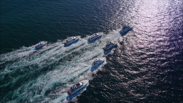 luxurious fancy yachts Convoy cruising in open waters in arrow shape