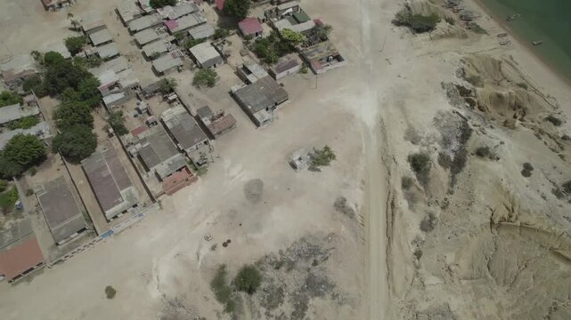 Aerial view of Pueblo de Araya's coastal homes in a dry landscape