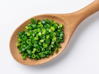 Wooden Spoon with chopped green onion on white background, top view