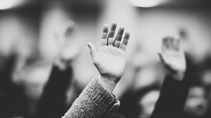 Hands are raised in a gathering to show agreement or participation