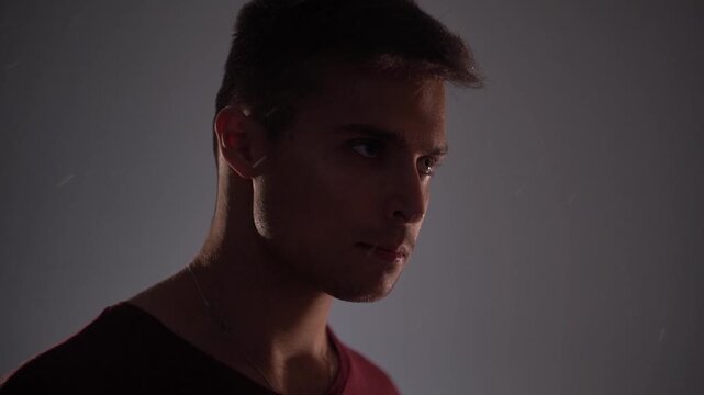 Young angry thoughtful man thinking and contemplating breathing deeply.