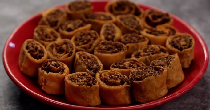Bhakarwadi also spelled as Bakarwadi or spring roll, is a traditional sweet and spicy snack originated in Pune, Maharashtra, a favourite tea-time snacks. Selective focus