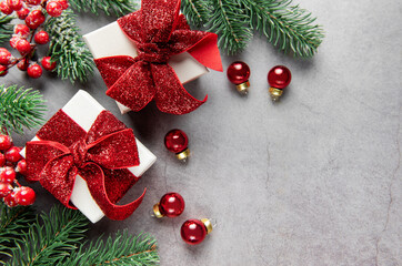 Christmas gifts and decorations on gray background