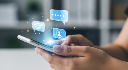 Person holding smartphone with floating chat bubbles and above it hand blue