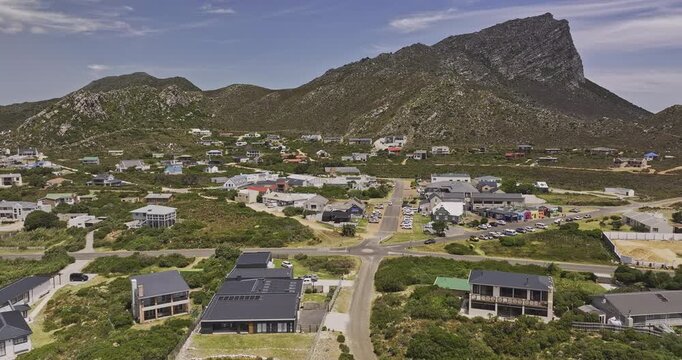 Pringle Bay South Africa Aerial v5 low flyover the coastal village capturing residential townscape and views of Hangklip mountains at daytime - Shot with Mavic 3 Pro Cine - Jan 9th 2024