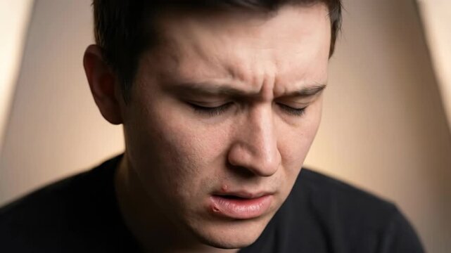 Man Expressing Distress and Confusion in Close-Up Shot.