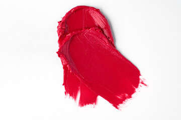 Double Red smear swipe isolated on white background texture beauty lipstick swatch..