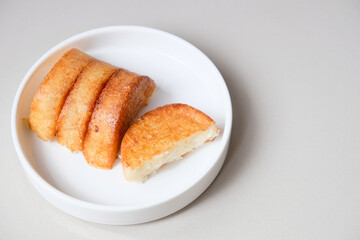 Kue pancong, gandos or bandros is an Indonesian traditional snack made from a mixture of rice flour, grated coconut, and coconut milk