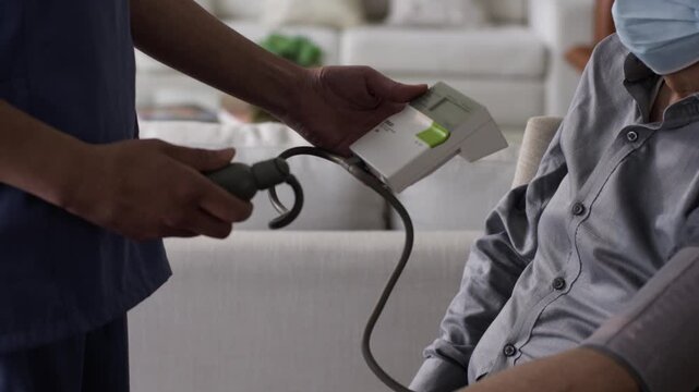 Checking a patient's blood pressure, health insurance concept