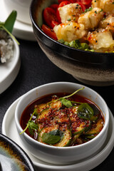 A large table with Asian cuisine