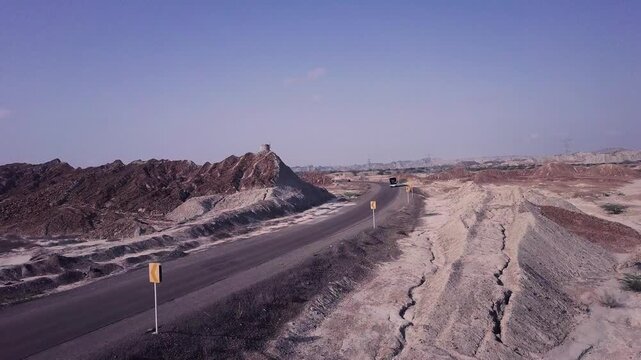 Forward-Moving Drone Shot of Vehicle on Makran Coastal Highway Through Buzi Pass, Balochistan, Pakistan