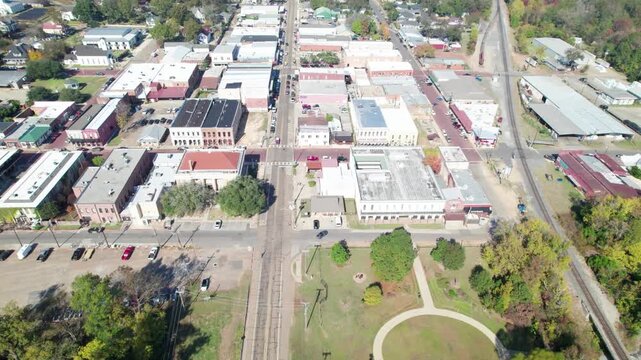 Aerial flight over Jefferson, Texas. Camera is flying approximately northwest over South Polk St.
