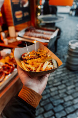 Currywurst and Fries in a Paper Tray at a European Street Food Market