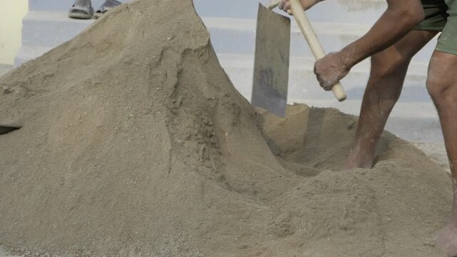Digging Into the Sand - A Worker's Persistence