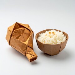 Brown Paper Geometric Sculpture and Bowl of White Rice on White Surface