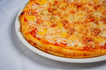 Freshly baked pizza topped with gooey cheese and a perfect golden crust awaits hungry diners
