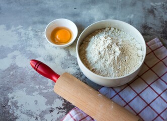 Baking ingredients and rolling pin on a countertop
