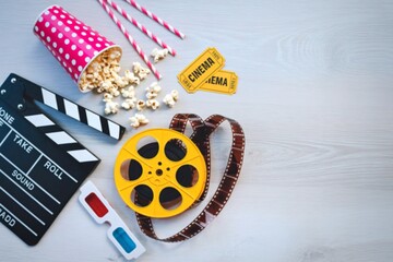 Cinema movie night essentials with popcorn and film reel