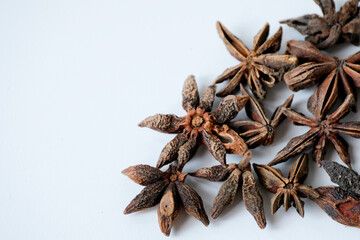 Close-up of dried star anise isolated on white background