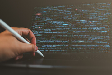 Close-up of a man’s hands coding HTML on a laptop screen, representing web development, programming, and the work of a professional developer.
