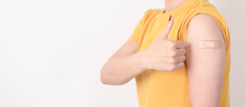 Adult Woman with bandage after received vaccine. Vaccination and Immunization for Influenza, HPV, Zoster, IPD, DTP or Diphtheria, Tetanus and Pertussis, MMR, Hepatitis B, Covid and Varicella vaccine