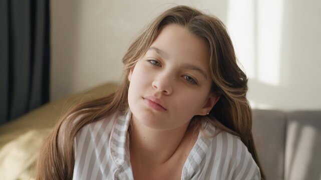 Teen Girl Enjoys Calm Morning, Young Female Peacefully Relaxing In Her Comfortable Home Environment, Teenage Girl Wearing Striped Pajamas Embracing Tranquil Morning Filled With Warm Sunlight