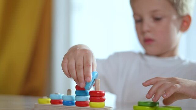 Child playing puzzle. Focused kid solving colorful puzzle game. Educational game boosts child cognitive development. Fun puzzle game enhances child learning. Puzzle game helps child skills development
