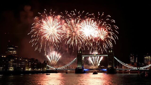 Stunning Fireworks Display Over Tower Bridge and Thames River at Night.