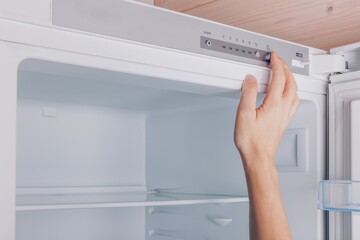 Adjusting Temperature Control of a Modern Refrigerator for Optimal Freshness and Energy Efficiency in Kitchen Storage Solutions