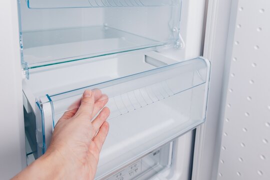 Exploring the Inside of a Refrigerator: Checking the Fresh Food Drawer and Organizing Space for Efficient Storage