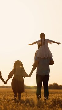 happy family child kid baby together teamwork dream fly children's dream silhouette sunset field park sun father mother, peaceful family time, golden hour family, siblings sunset play, carefree family