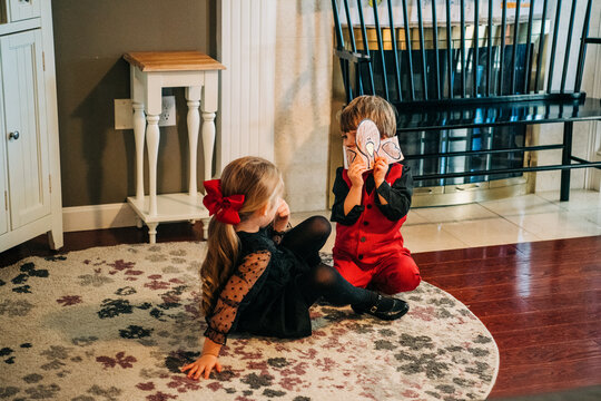 Children playing role game with handmade masks